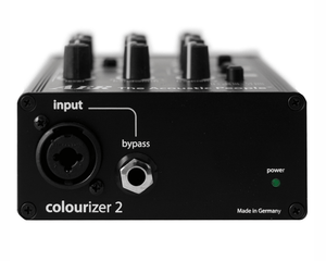 Close-up of the AER Colourizer 2 preamplifier, showcasing its compact, black design and control knobs for enhancing instrument and microphone sound quality.