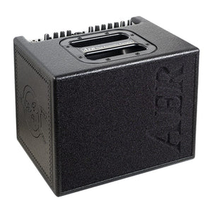 AER Compact 60/4 Tommy Emmanuel Signature Amp, a black amplifier with knobs designed for superior musical performance and tone, ideal for live and studio use.