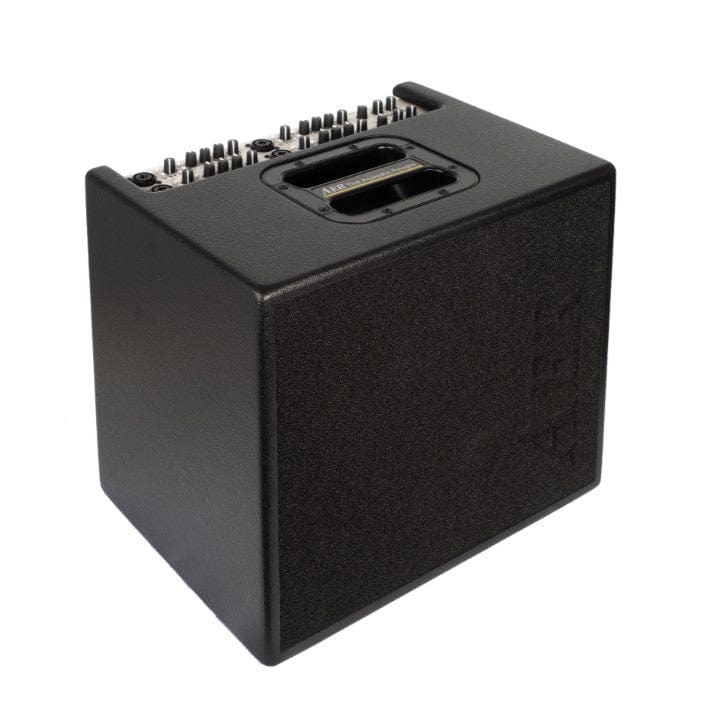 AER Domino 3 Acoustic Amplifier with knobs and buttons for control, featuring two speakers and a powerful 600-watt power amp.