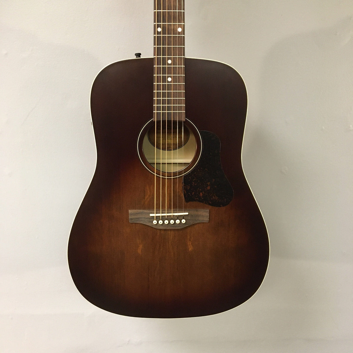 Art & Lutherie Americana Bourbon Burst Acoustic-Electric Guitar with rosewood bridge and fingerboard, showcased on a white background.