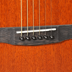 Close-up of the Bodhi BG10M African Okoume Mahogany Top Concert Body Acoustic Guitar, highlighting its strings and wood craftsmanship.
