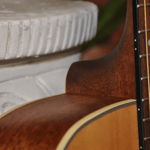 Bodhi BG10S Solid Spruce Top Concert Body Acoustic Guitar close-up, showcasing strings, fretboard, and detailed craftsmanship for optimal playability and balanced sound.