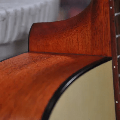 Bodhi BG20 Spruce Top Dreadnaught Body Acoustic Guitar close-up, highlighting its advanced X-Bracing and mahogany back for rich sound and durability.