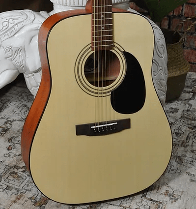 Bodhi BG20 Spruce Top Dreadnaught Body Acoustic Guitar placed on a rug.