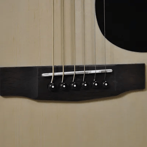 Close-up of Bodhi BG20 Spruce Top Dreadnaught Body Acoustic Guitar, showcasing strings and detailed craftsmanship for exceptional sound quality.