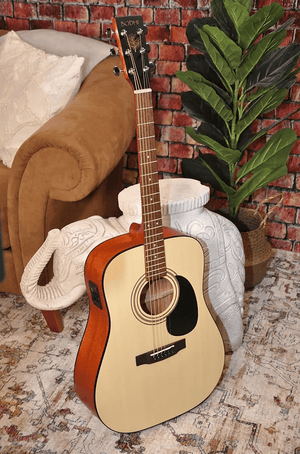 Bodhi BG20E Spruce Top Dreadnaught Body Acoustic-Electric Guitar leaning against a chair, showcasing its sturdy build and elegant design.