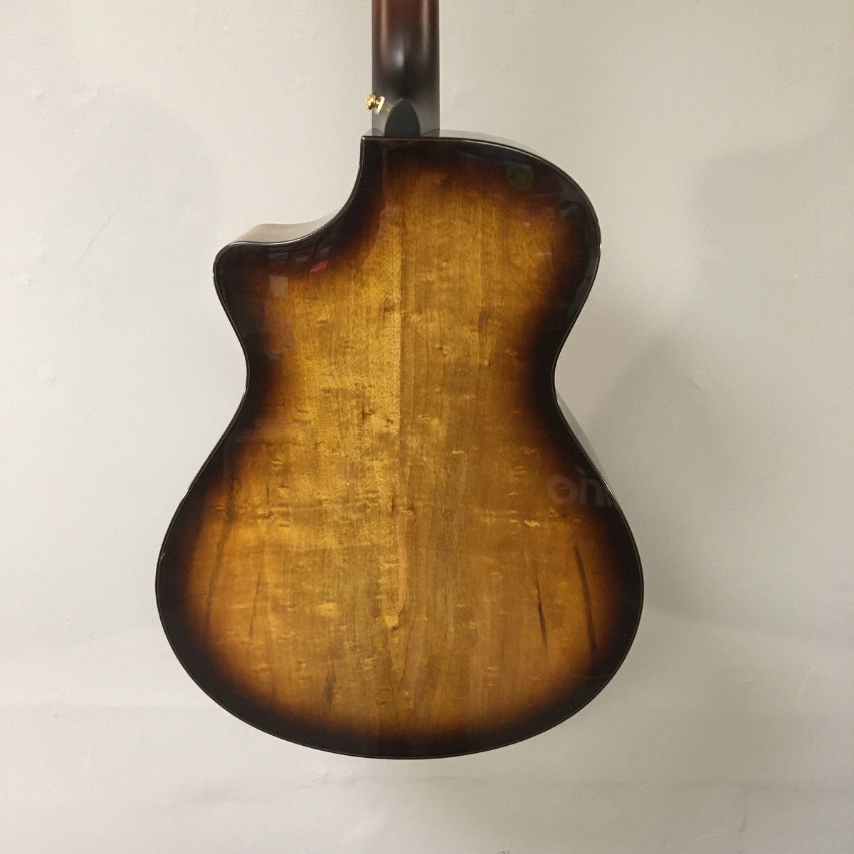 Breedlove Artista Pro Concerto guitar with burnt amber finish, emphasizing its spruce top, myrtlewood sides, and included hardcase.