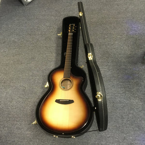 Breedlove Artista Pro Concerto Burnt Amber CE European-Myrtlewood guitar in open hardshell case with gold hardware.