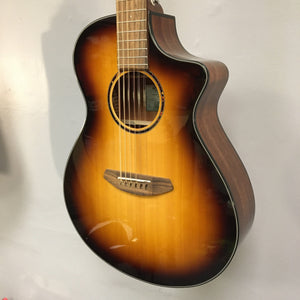 Breedlove Discovery S Concert CE 12-string Edgeburst acoustic guitar with visible strings, showing a small cosmetic blemish on the finish.