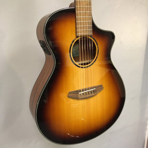 Breedlove Discovery S Concert CE 12-string Edgeburst guitar with minor blemish, showcasing its intricate strings and detailed craftsmanship.
