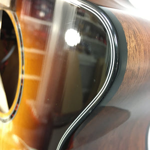 Close-up of Breedlove Discovery S Concert CE 12-string Edgeburst guitar showcasing its body and finish details.