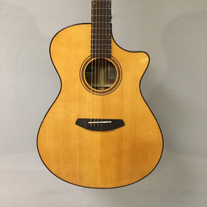 A close-up of the Breedlove Performer Pro Concerto Aged Toner acoustic guitar, showcasing its sleek design and delivering a rich, dreadnought-like sound; includes case.