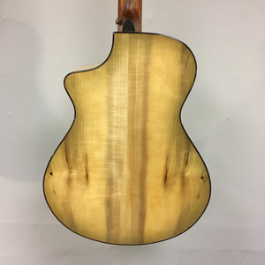 Close-up of a Breedlove Pursuit Exotic S Concert Sweetgrass CE B-Stock acoustic guitar, highlighting its detailed craftsmanship and high-quality wood finish.