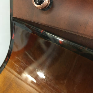 Close-up of a Breedlove Pursuit Exotic S Concerto CE Tiger's Eye Myrtlewood B-Stock guitar, highlighting the detailed craftsmanship and finish blemishes on the binding.