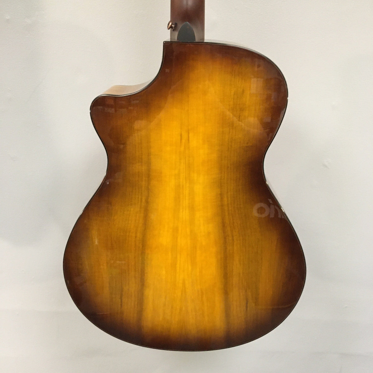 Close-up of a Breedlove Pursuit Exotic S Concerto CE Tiger's Eye Myrtlewood acoustic guitar, showcasing the detailed binding and finish.