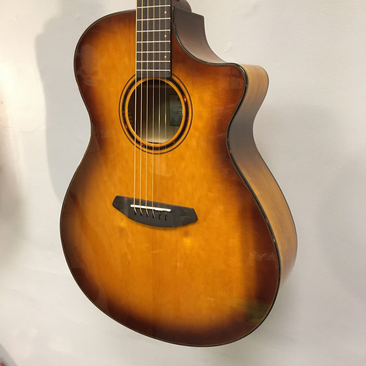 Breedlove Pursuit Exotic S Concerto CE Tiger's Eye Myrtlewood B-Stock acoustic guitar with minor binding blemishes, detailed close-ups highlighting finish and craftsmanship.