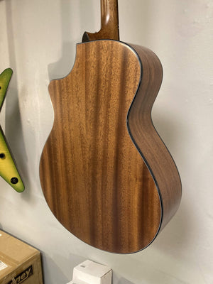 Close-up of Breedlove Wildwood Concerto Satin CE guitar, showcasing solid African mahogany body and neck, with visible premium Breedlove chrome tuners.