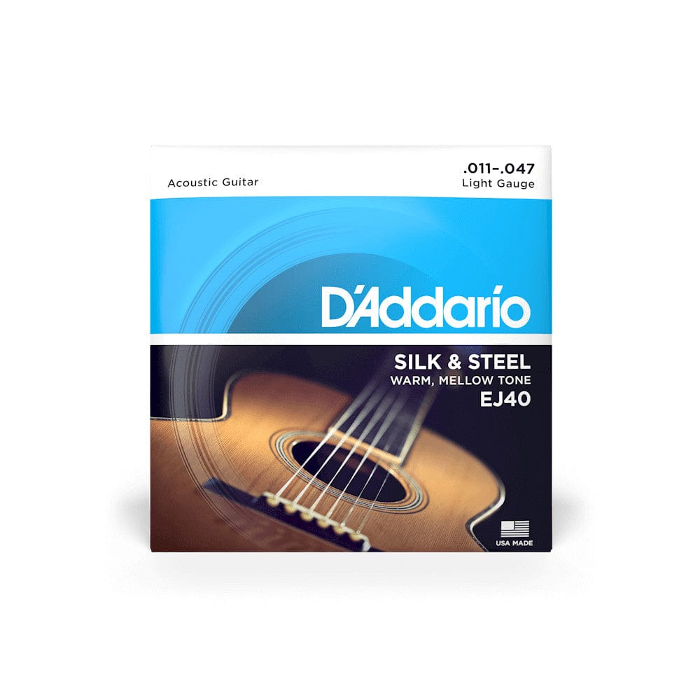 D'Addario EJ40 Silk and Steel Folk Acoustic Guitar Strings box for light gauge (.011-.047), shown close-up with a guitar in the background.