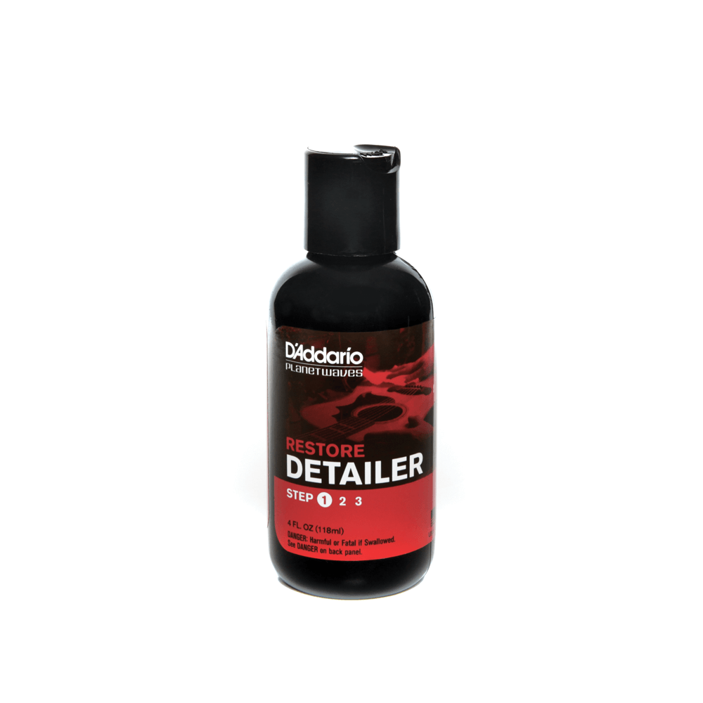 D'Addario Restore Deep Cleaning Polishing Cream in a black bottle with a red label, designed for removing swirl marks and light scratches from clear coated instruments.