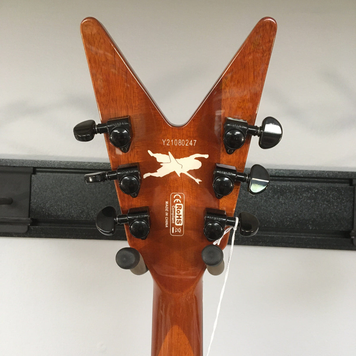 Close-up of the Dean Dimebag Dime Slime ML Electric Guitar showcasing its headstock and Floyd Rose Special tremolo bridge.