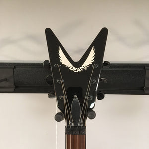 Dean Dimebag Dime Slime ML Electric Guitar on a stand with V profile neck and Floyd Rose tremolo bridge.