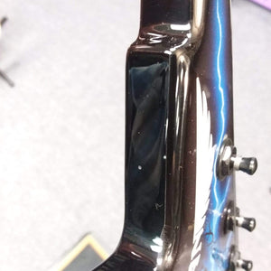 Close-up of the Dean Razorback Lightning B Stock guitar headstock, showcasing its professional-grade build and minor cosmetic blemish.