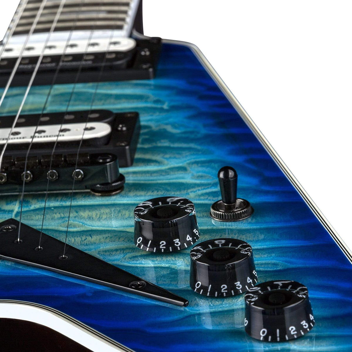 Close-up of a Dean V Select Quilt Top Ocean Burst electric guitar, showcasing the strings, dials, and satin neck.