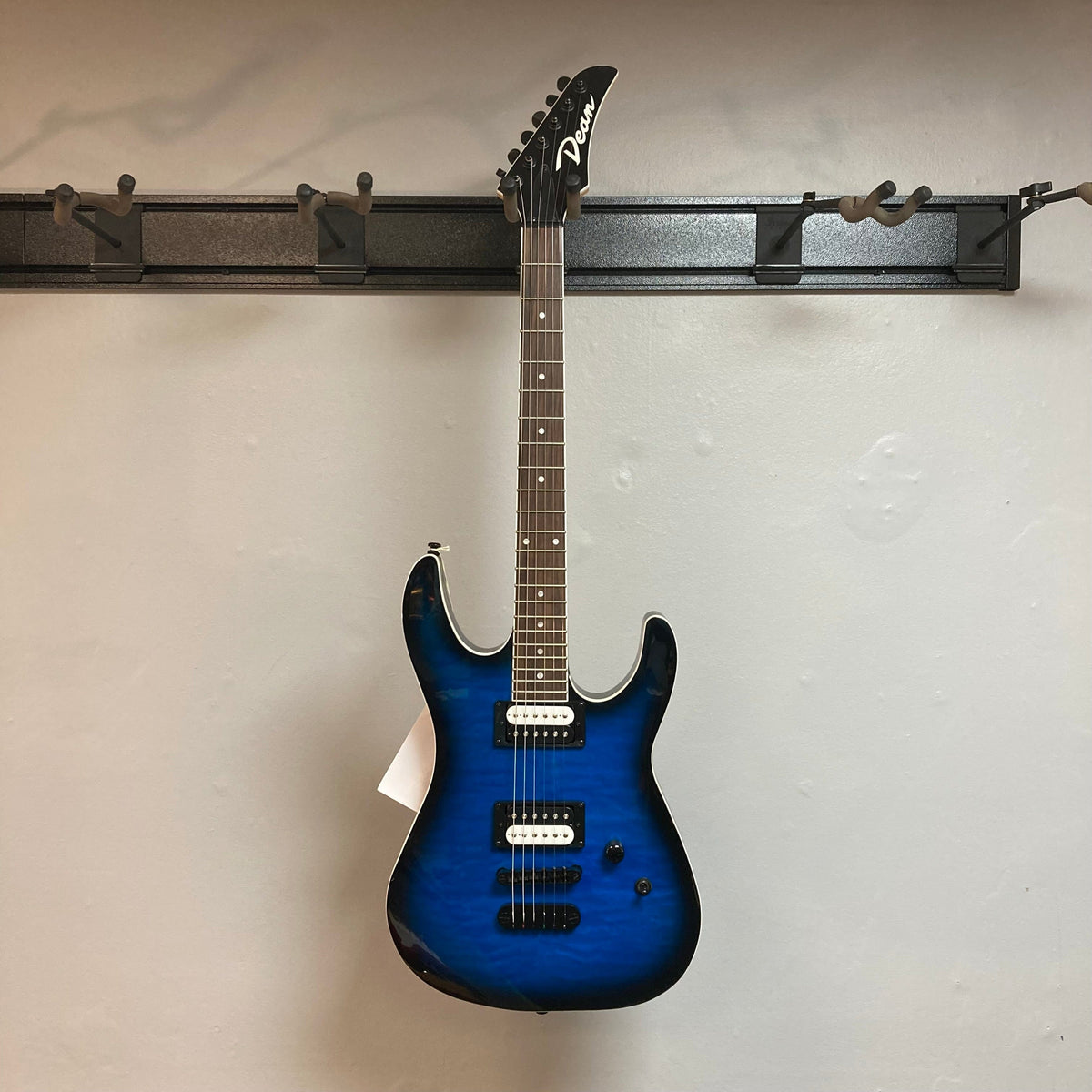 Dean MD X Quilt Maple Trans Blue Burst electric guitar, featuring a 22-fret maple neck, rosewood fingerboard, and DMT Designed High Output Zebra Pickups.