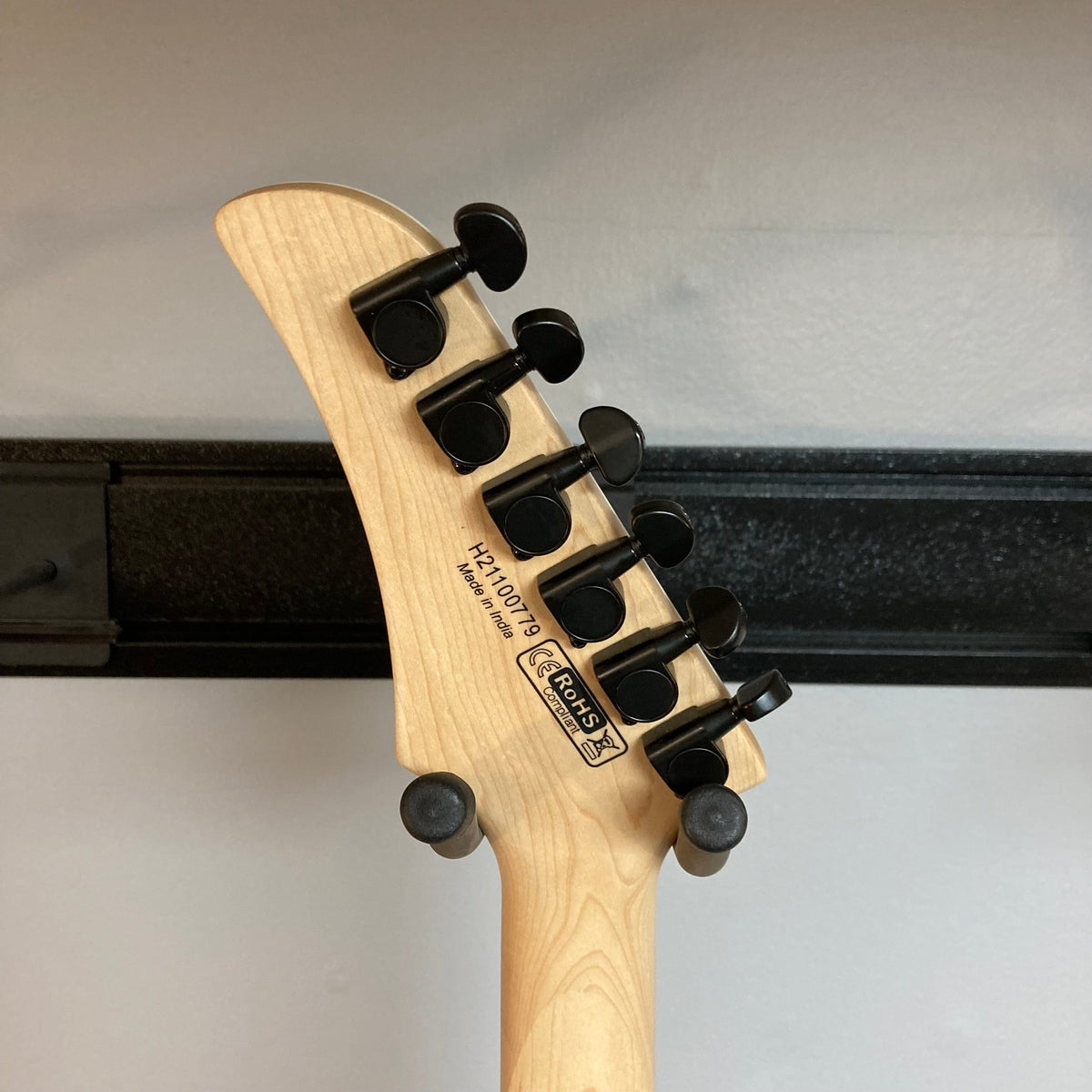 Close-up of the Dean MD X Quilt Maple Trans Blue Burst guitar headstock, highlighting the tuning pegs and intricate craftsmanship.