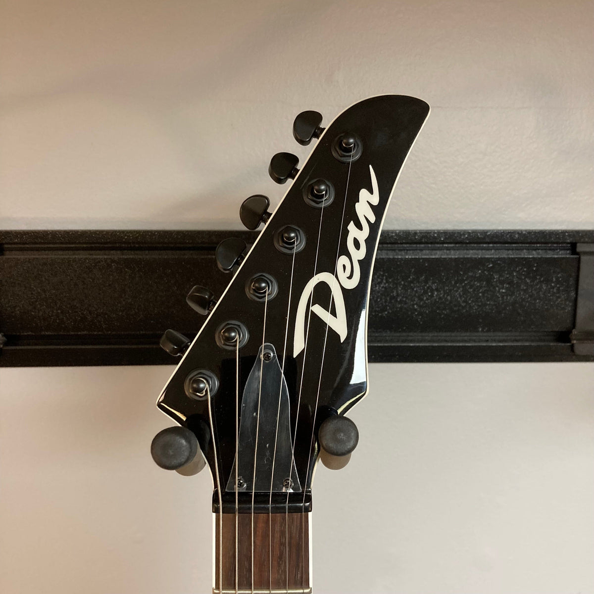 Dean MD X Quilt Maple Trans Blue Burst Open Box guitar headstock with pegs and close-up details of the fretboard and pickups.