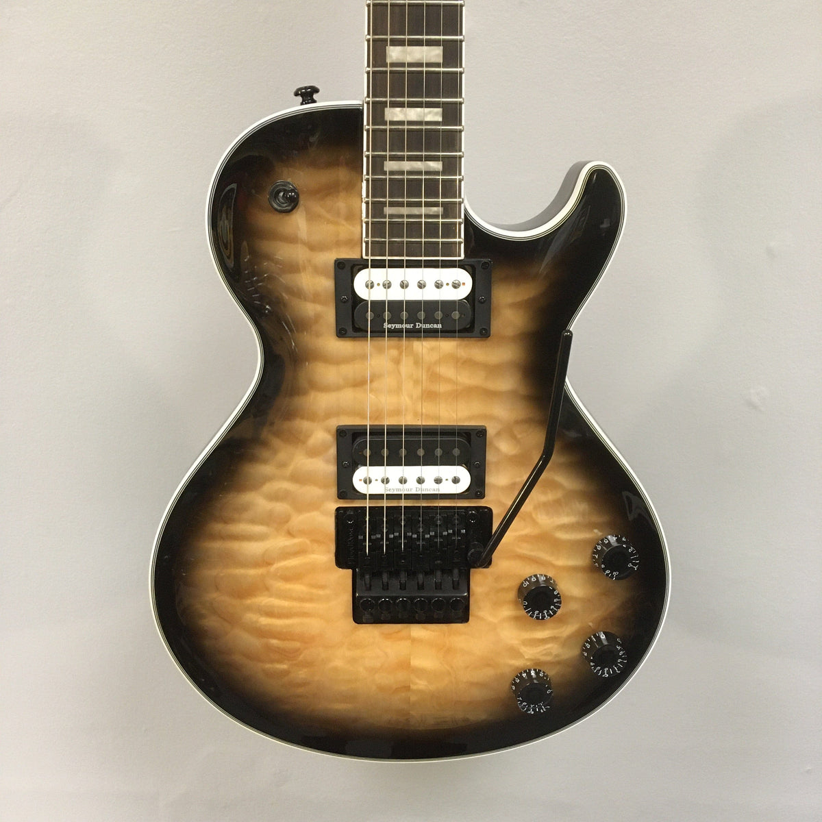 Dean Thoroughbred Select Quilt-top guitar with satin neck, Seymour Duncan pickups, and Floyd Rose bridge, displayed for professional musicians.
