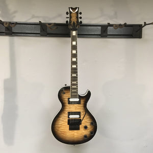Dean Thoroughbred Select Quilt-top guitar with Floyd Rose bridge, Seymour Duncan pickups, and satin-finished neck on a stand.