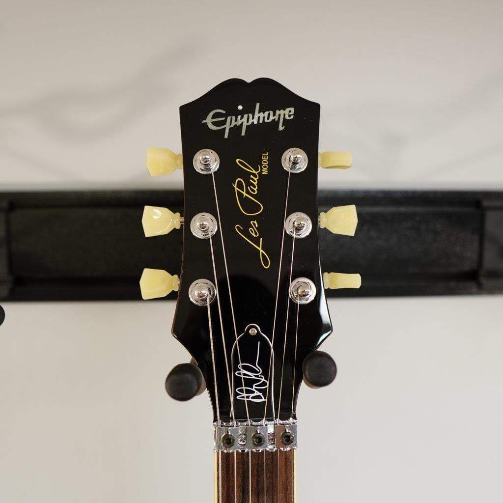 Close-up of the Epiphone Alex Lifeson Les Paul Axcess Standard guitar neck and headstock, showcasing detailed craftsmanship and design elements.