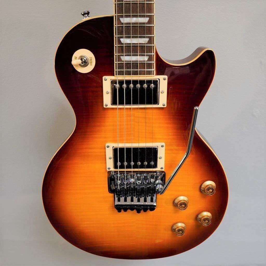 Close-up of an Epiphone Alex Lifeson Les Paul Axcess Standard guitar, highlighting the intricate string and switch details.