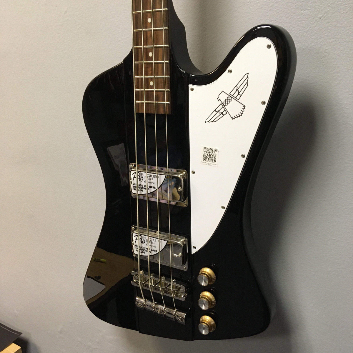 Epiphone Thunderbird Vintage PRO Bass Black with ProBucker™ Bass Humbuckers, mahogany body, and vintage-styled bridge, displayed close-up showing knobs and strings.
