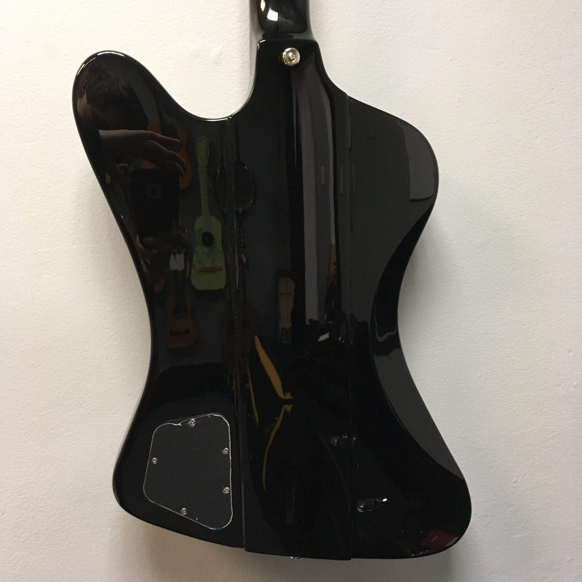 Black Epiphone Thunderbird Vintage PRO Bass with powerful ProBucker™ Bass Humbuckers and vintage design, displayed on a white surface.