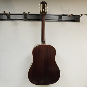 Epiphone Masterbilt J-45 Aged Vintage Sunburst Gloss guitar displayed on a wall.