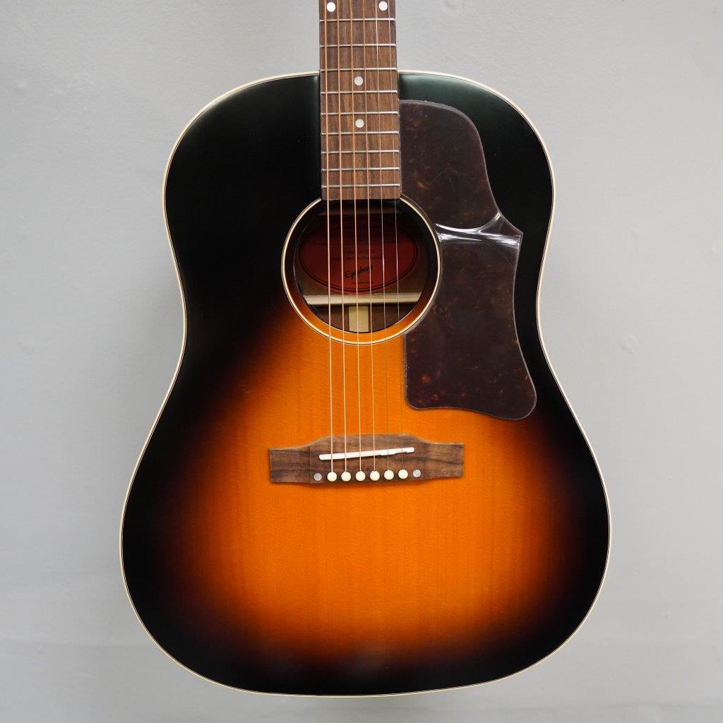 Epiphone Masterbilt J-45 Aged Vintage Sunburst Gloss guitar with solid wood construction and 20 medium jumbo frets displayed against a plain background.
