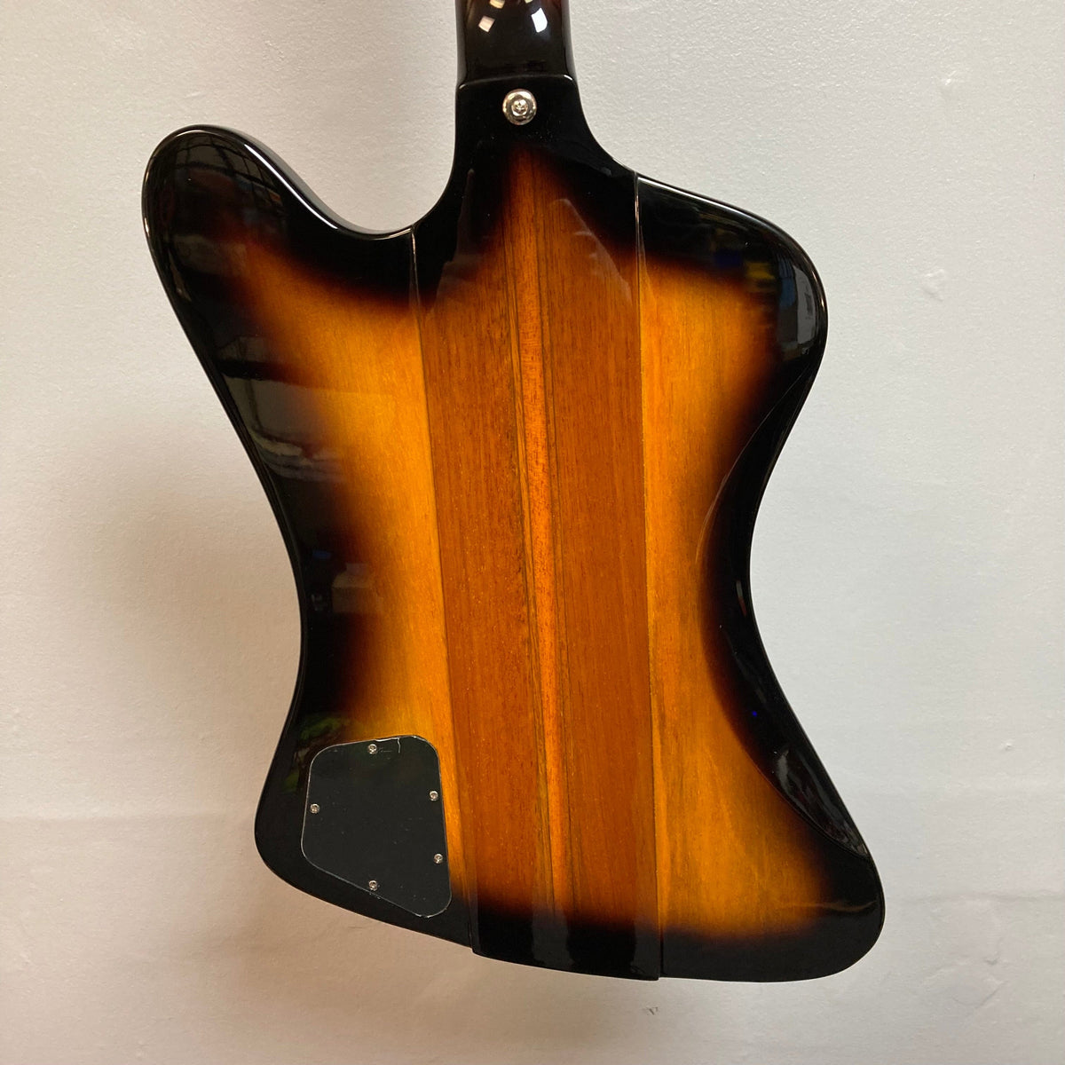 Epiphone Thunderbird IV Reverse Headstock Vintage Sunburst bass guitar, close-up view showing strings and black hardware.