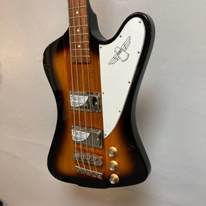 Epiphone Thunderbird IV Reverse Headstock Vintage Sunburst electric bass guitar, close-up of body, dials, and neck. Iconic rock and roll design, in stock.