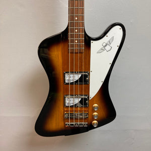 Epiphone Thunderbird IV Reverse Headstock Vintage Sunburst bass guitar, featuring a distinctive zig-zag body design and unique headstock, mounted on a wall.