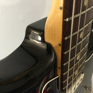 1976 Fender Stratocaster Sunburst, all original with case and paperwork, close-up of guitar strings and body in great condition.