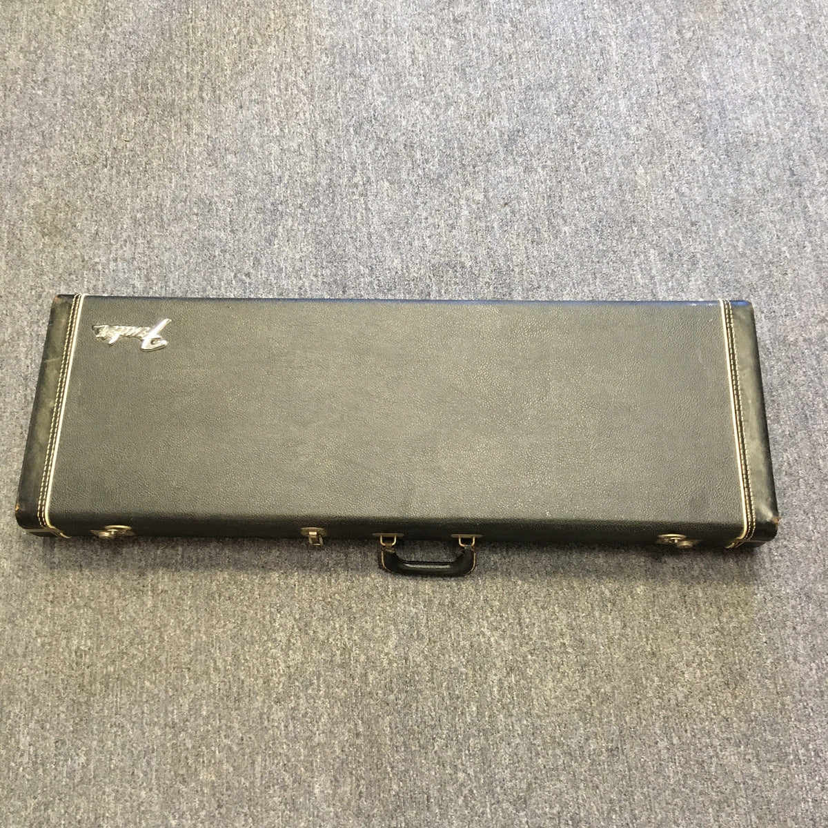 1976 Fender Strat Sunburst Guitar with original case and paperwork, displayed on carpet.