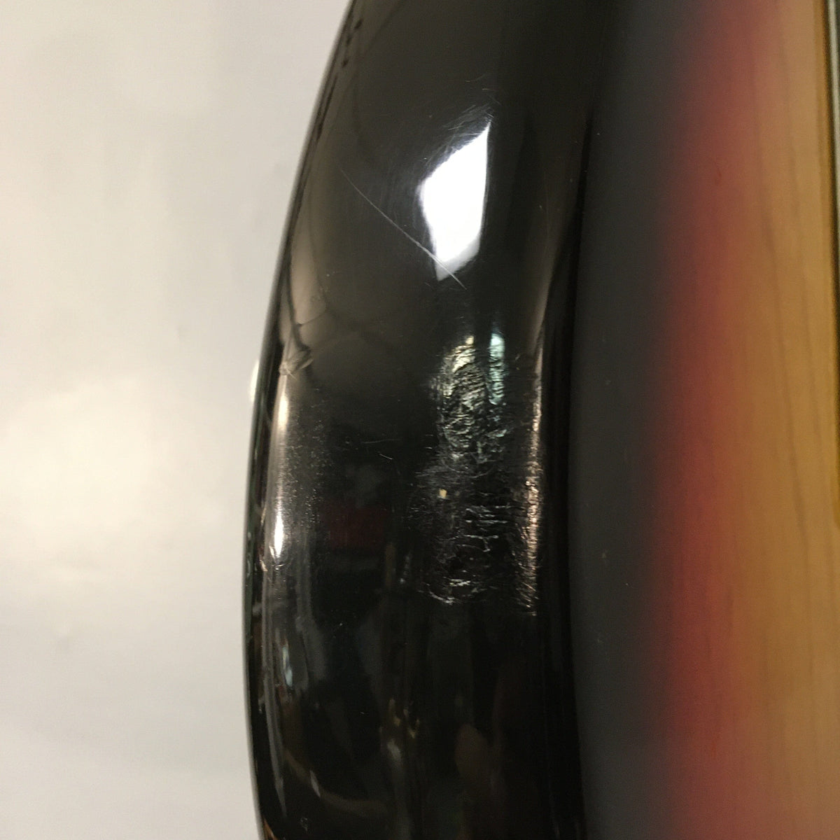 1976 Fender Stratocaster Sunburst, all original with case and paperwork, close-up of body, showcasing excellent condition and vintage features.