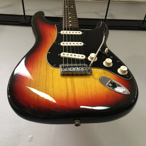 1976 Fender Stratocaster Sunburst, all original, close-up of guitar body and strings, in great condition, includes original case and paperwork.