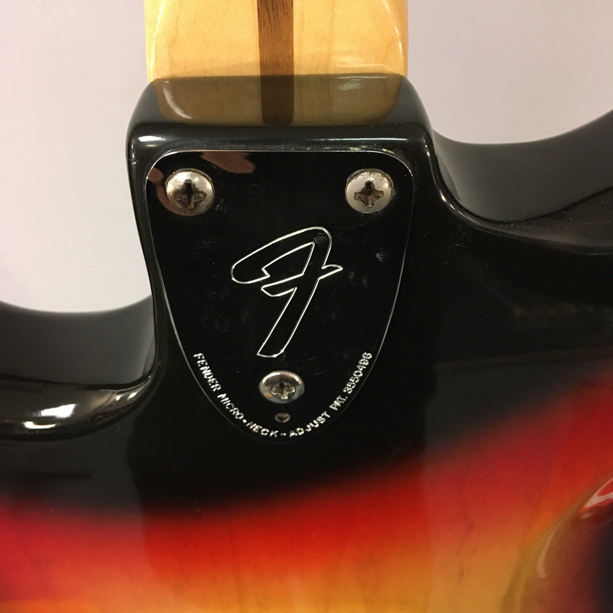1976 Fender Stratocaster Sunburst, all original with case and paperwork, close-up of guitar's back, screw, and neck details.