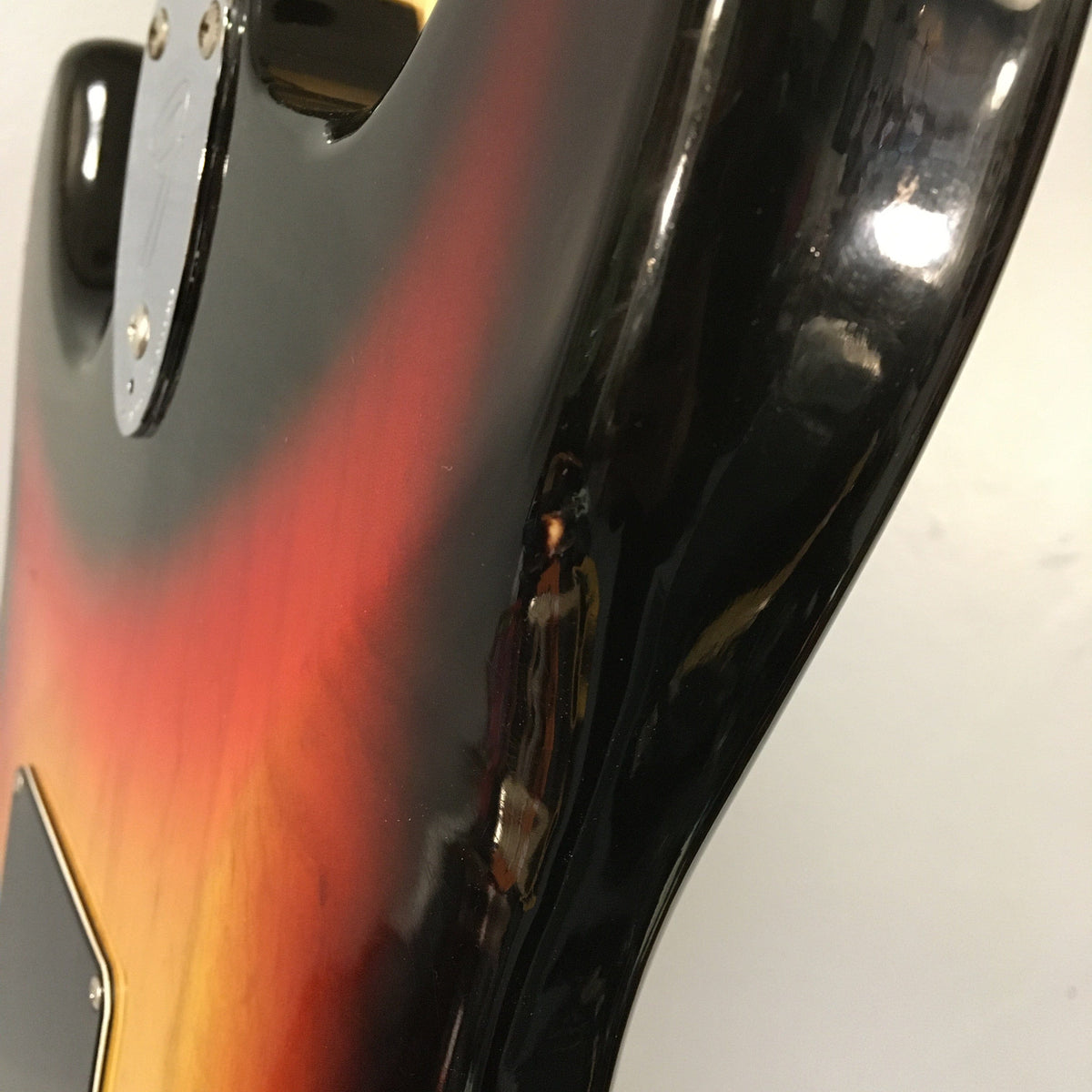 1976 Fender Stratocaster Sunburst, all original, close-up of the guitar's bottom, showcasing its condition and original parts.