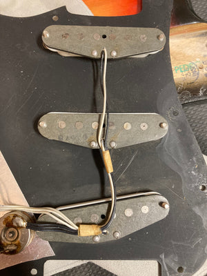 1976 Fender Stratocaster Sunburst, all original parts, includes original case and paperwork; close-up of metal parts and wires visible.
