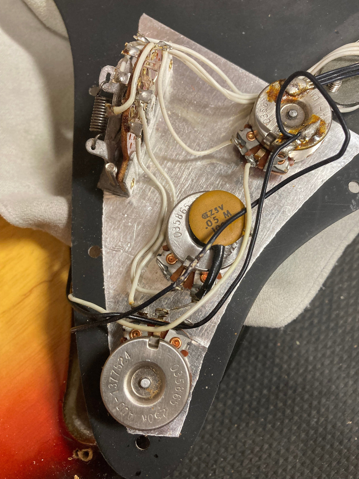 Vintage 1976 Fender Stratocaster Sunburst, all original parts, close-up of bridge and tremolo bar.