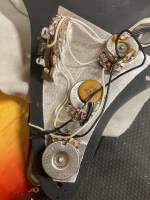 Vintage 1976 Fender Stratocaster Sunburst, all original parts, close-up of bridge and tremolo bar.